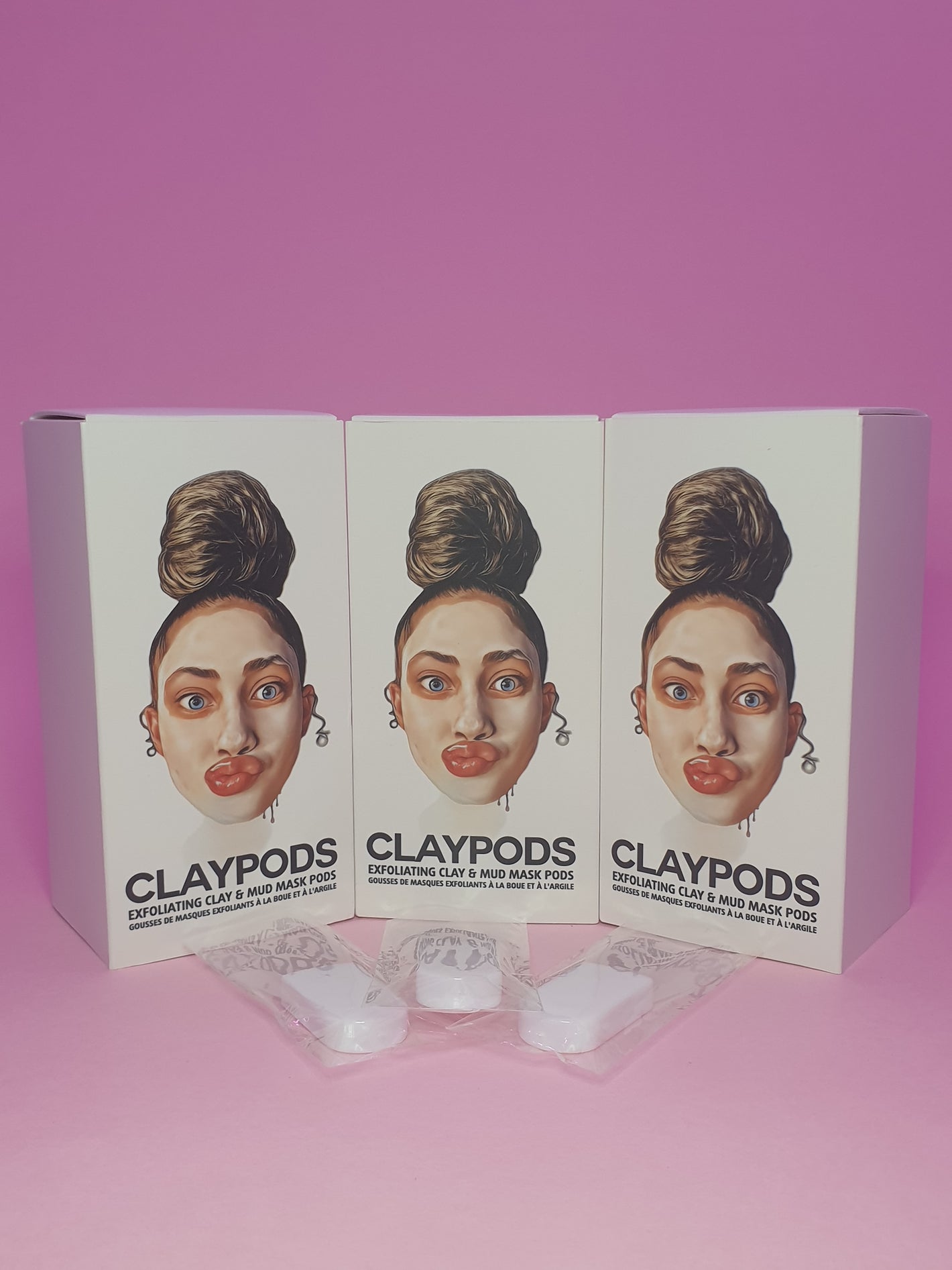 boxes of clay pods with mud mask brushes