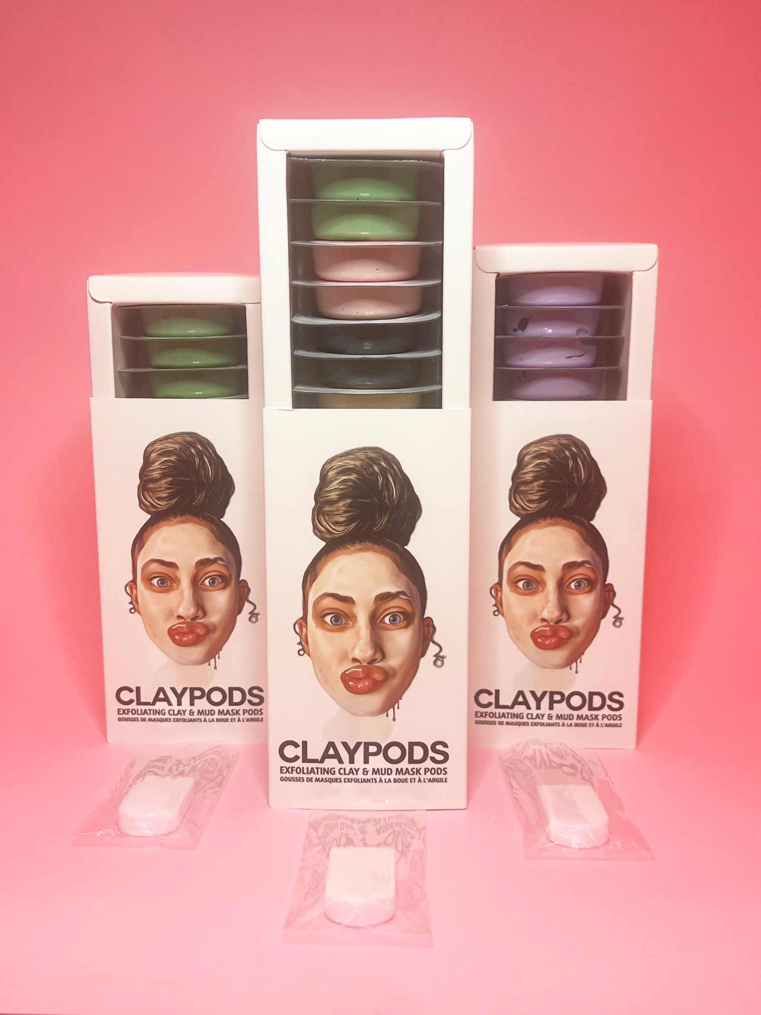 Feature image, 3 boxes of clay pods with mud mask brushes